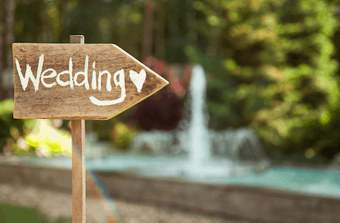Sign pointing to a wedding