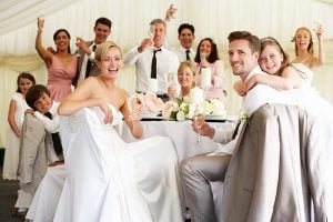 Guests sitting at a table at a wedding